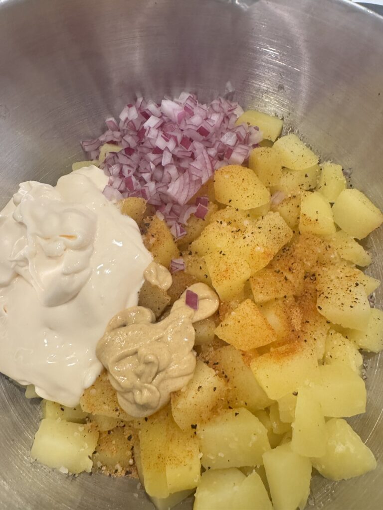 potato salad ingredients in a mixing bowl