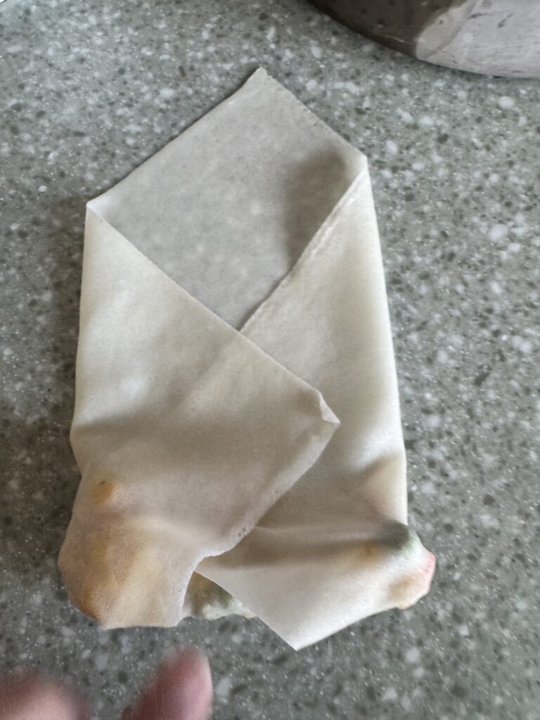 egg roll wrappers folding in on both sides