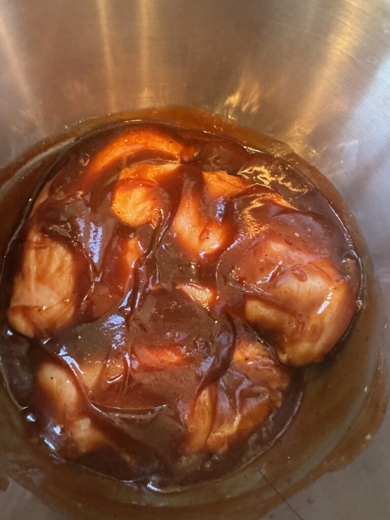chicken breasts slathered in bbq sauce in instant pot