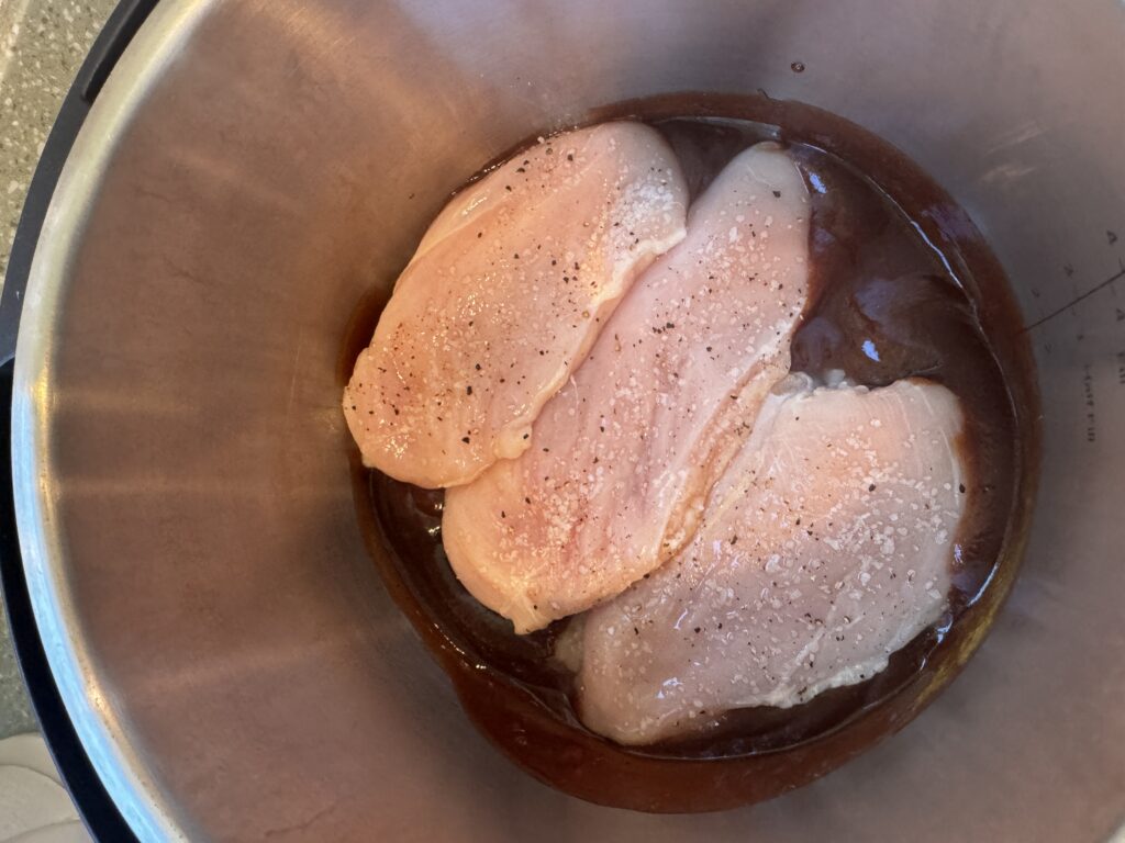 seasoned chicken breast in bbq sauce in instant pot