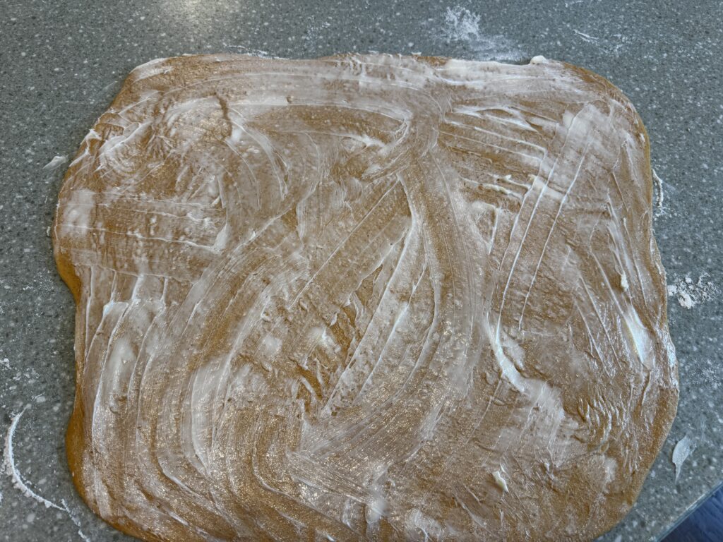 buttered rolled out pumpkin cinnamon dough 